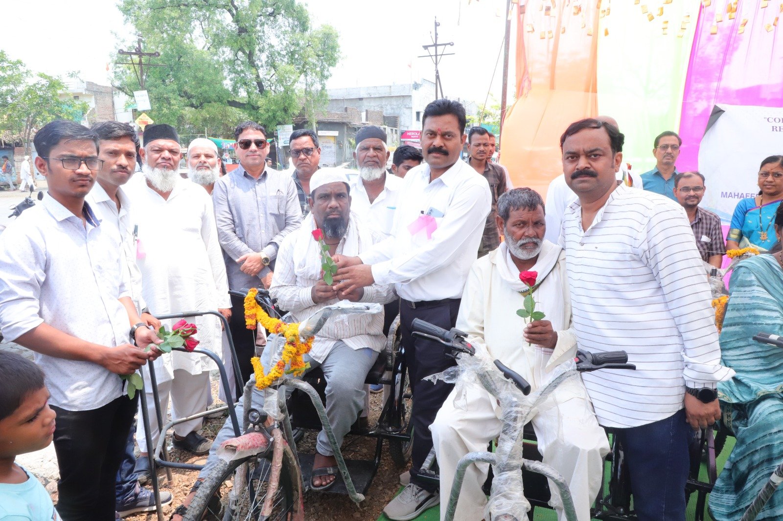 People with battery-operated tricycles